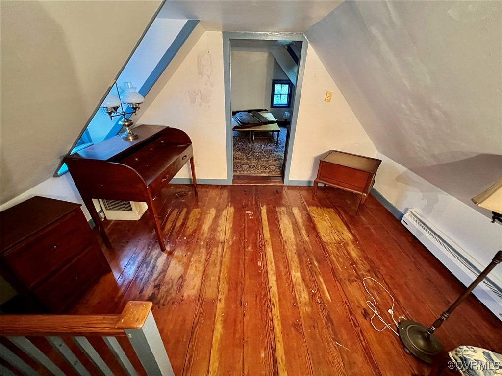 11075 Buckley Hall Road Mathews, VA 23109 - Photo 23 of 38 a bedroom with wooden floor and staircase