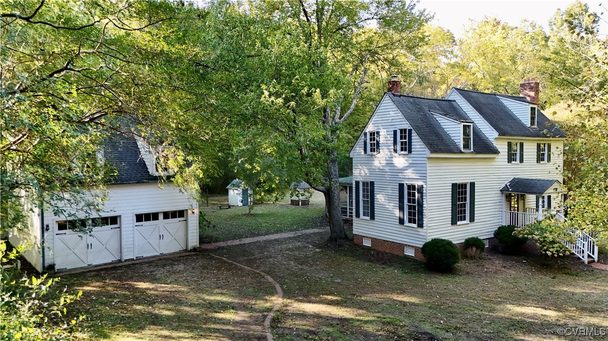 11075 Buckley Hall Road Mathews, VA 23109 - Photo 3 of 38 a view of a house with a big yard plants and large trees