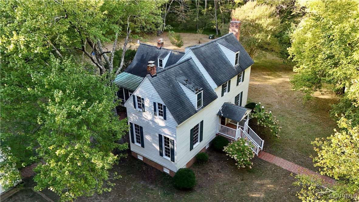 11075 Buckley Hall Road Mathews, VA 23109 - Photo 4 of 38 a view of a house with a yard and large trees