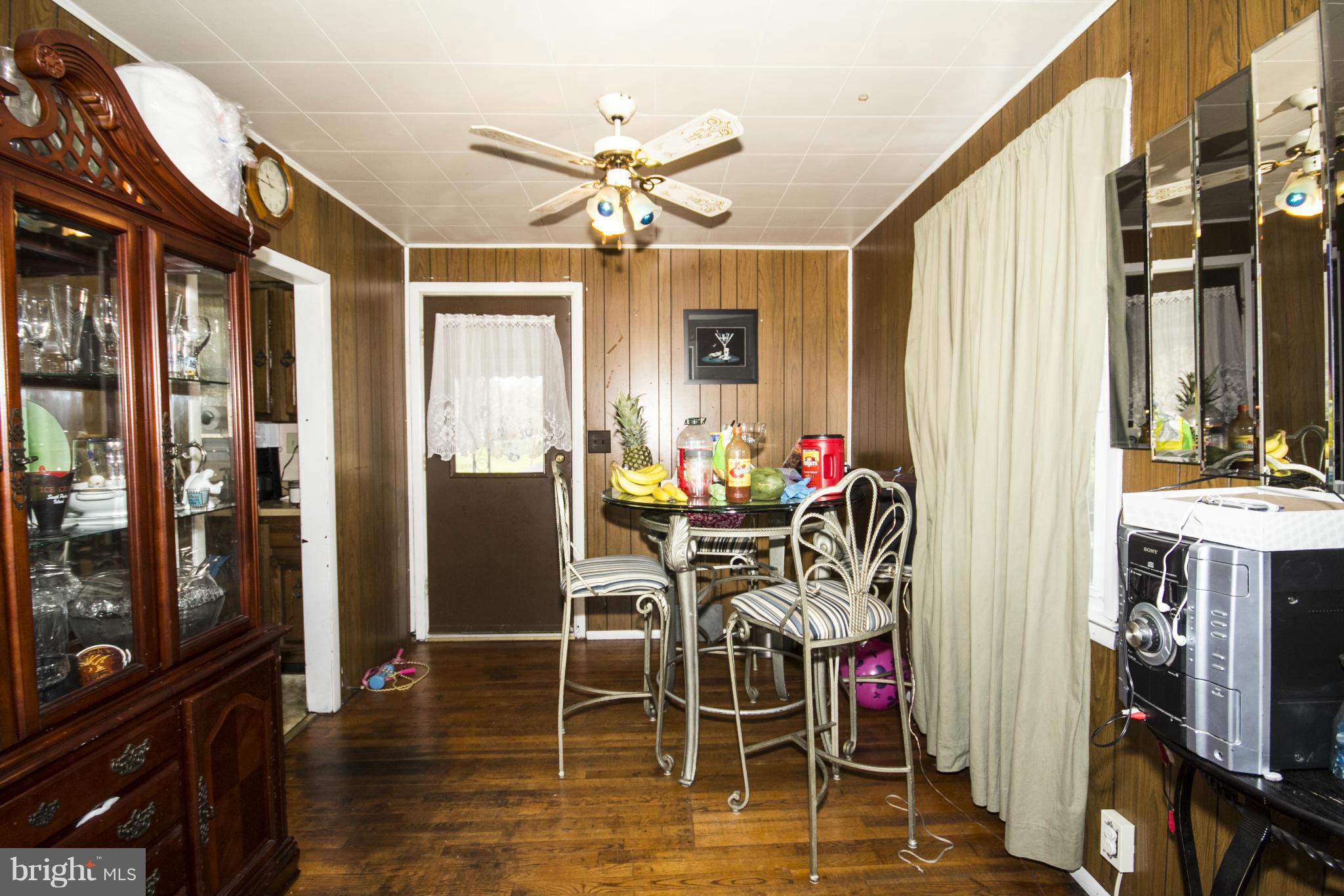 5108 Old Court Road Randallstown, MD 21133 - Photo 5 of 13 a view of a dining room with furniture and chandelier