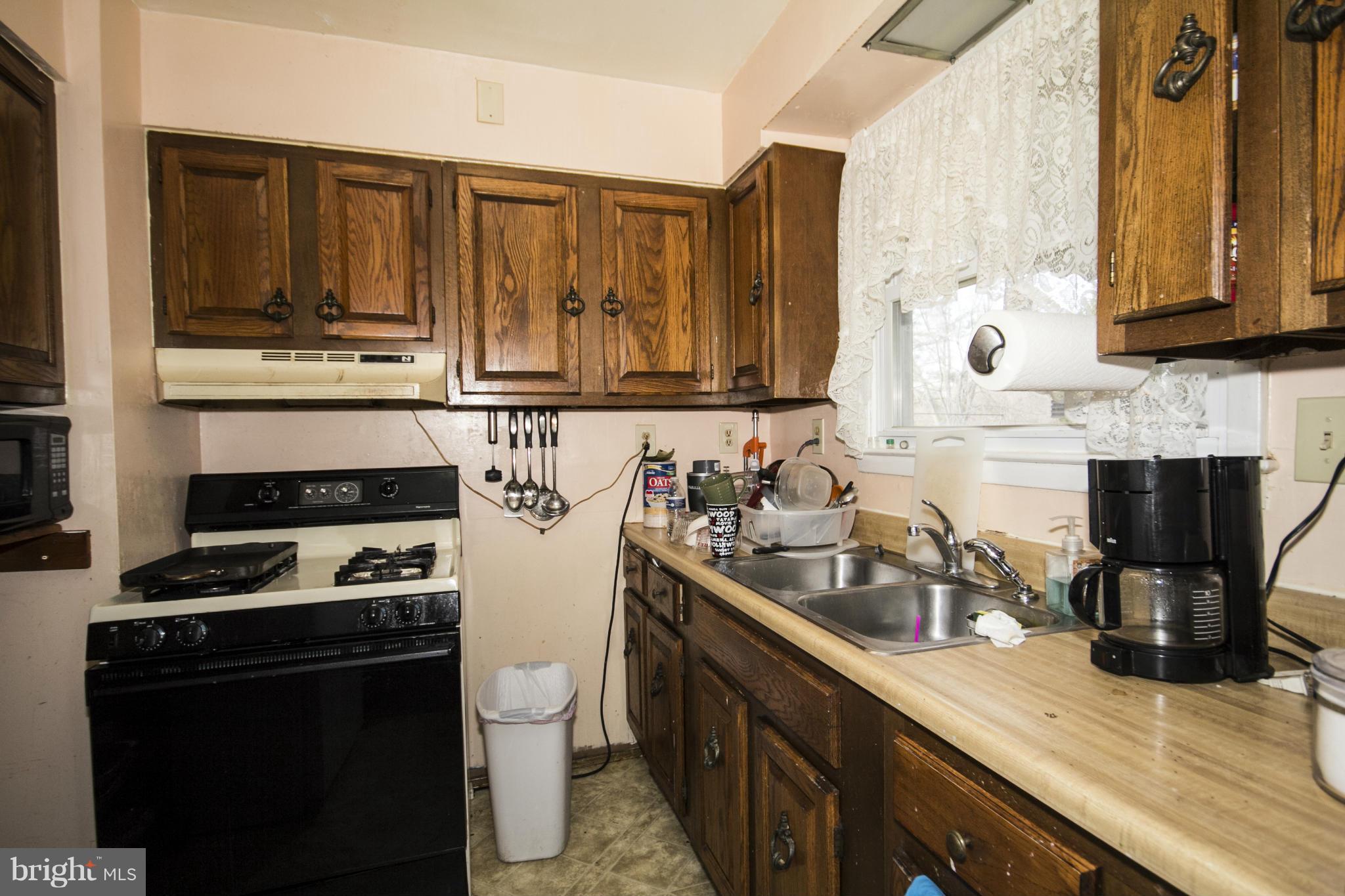 5108 Old Court Road Randallstown, MD 21133 - Photo 6 of 13 a kitchen with a sink and cabinets