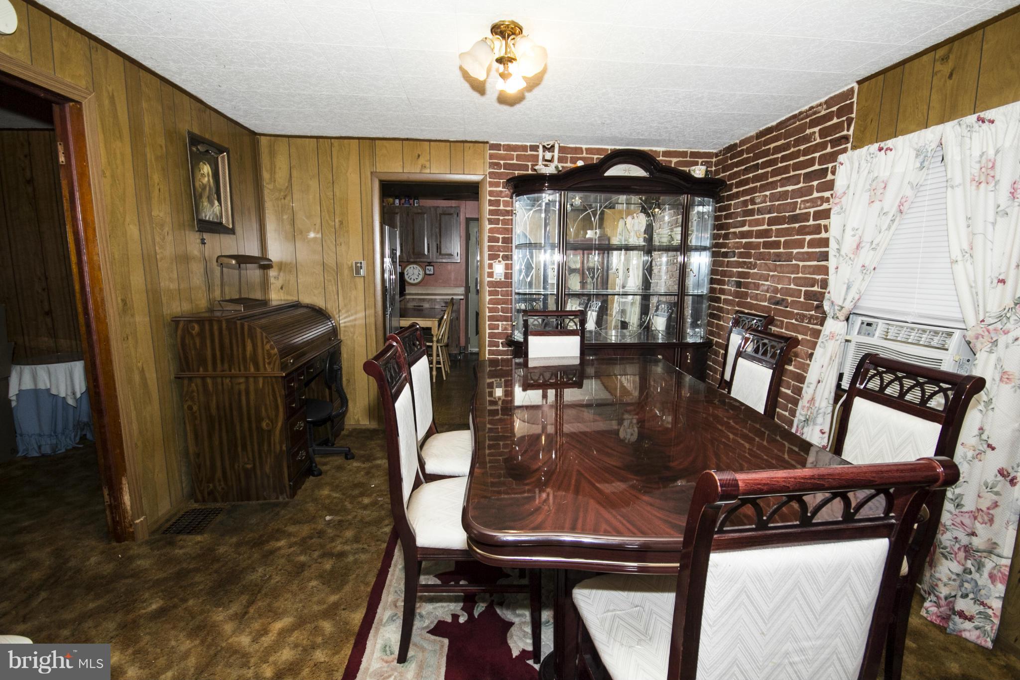 5108 Old Court Road Randallstown, MD 21133 - Photo 10 of 13 a dining room with furniture and chandelier