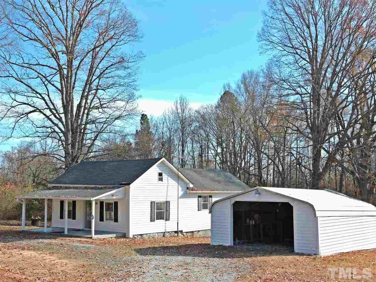 26 Raney Crumpton Road Roxboro, NC 27574 - Photo 7 of 7 a front view of a house with a yard