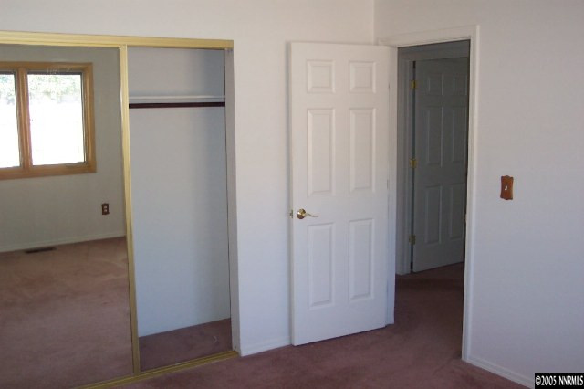20595 Eaton Road Reno, NV 89521 - Photo 4 of 9 a view of an empty room with closet and a window