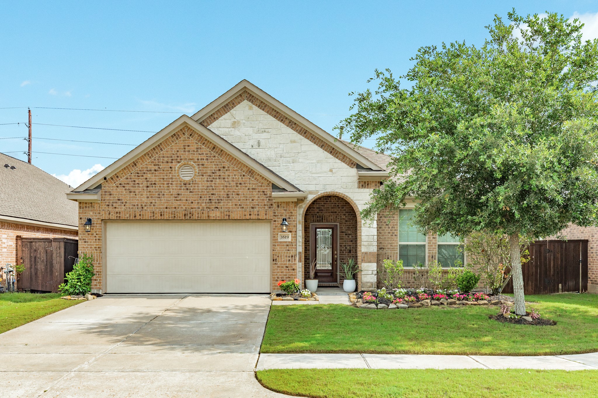 Welcome to your new home! Located at the end of a quiet cul-de-sac, 3519 Bay Dr boasts incredible curb appeal with its stunning stone and brick facade and meticulously maintained professional landscaping.