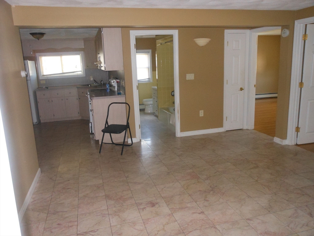 21 Cook, Unit 1 Chelsea, MA 02150 - Photo 25 of 32 a view of a livingroom with furniture and windows
