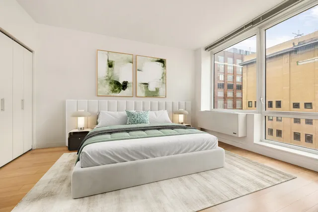 a kitchen with stainless steel appliances a stove a sink and a refrigerator