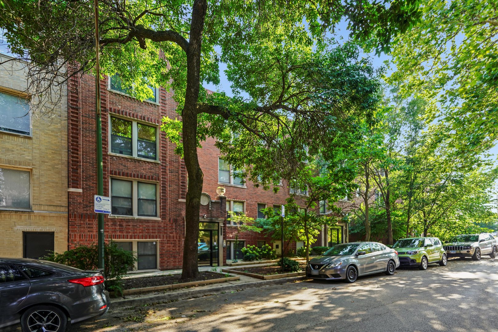 1627 West Columbia Avenue, Unit GW Chicago, IL 60626 - Photo 1 of 28 a view of street with parked cars