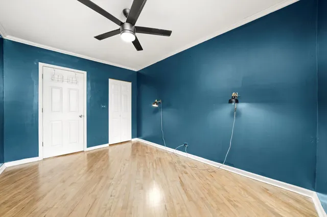 a view of a room with a ceiling fan