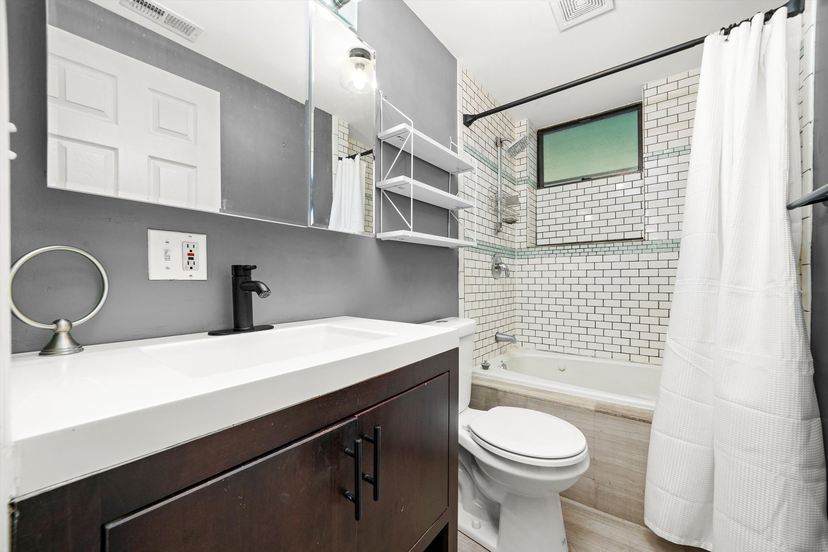 1627 West Columbia Avenue, Unit GW Chicago, IL 60626 - Photo 16 of 28 a bathroom with a sink a toilet and shower