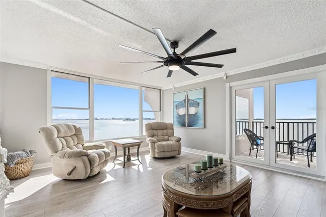 a living room with couch and a large window