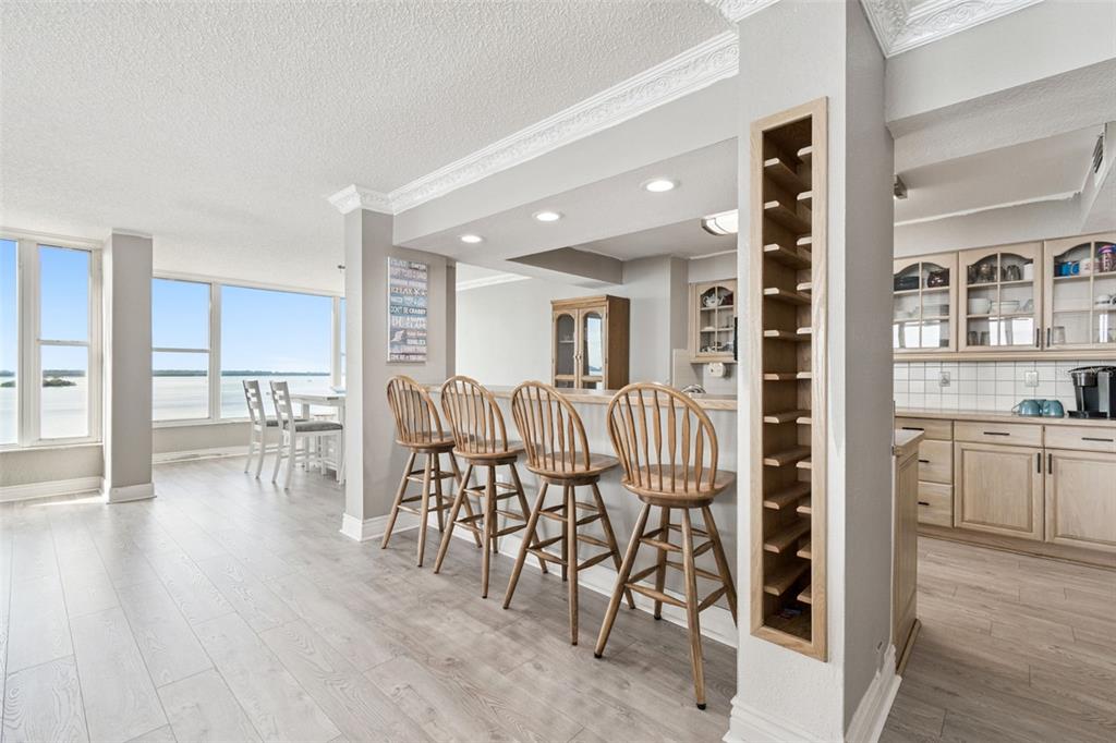 634 Edgewater Drive, Unit 844 Dunedin, FL 34698 - Photo 5 of 68 a dining room with furniture and wooden floor