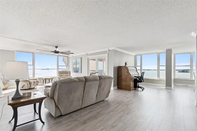 a kitchen with white cabinets sink and stainless steel appliances