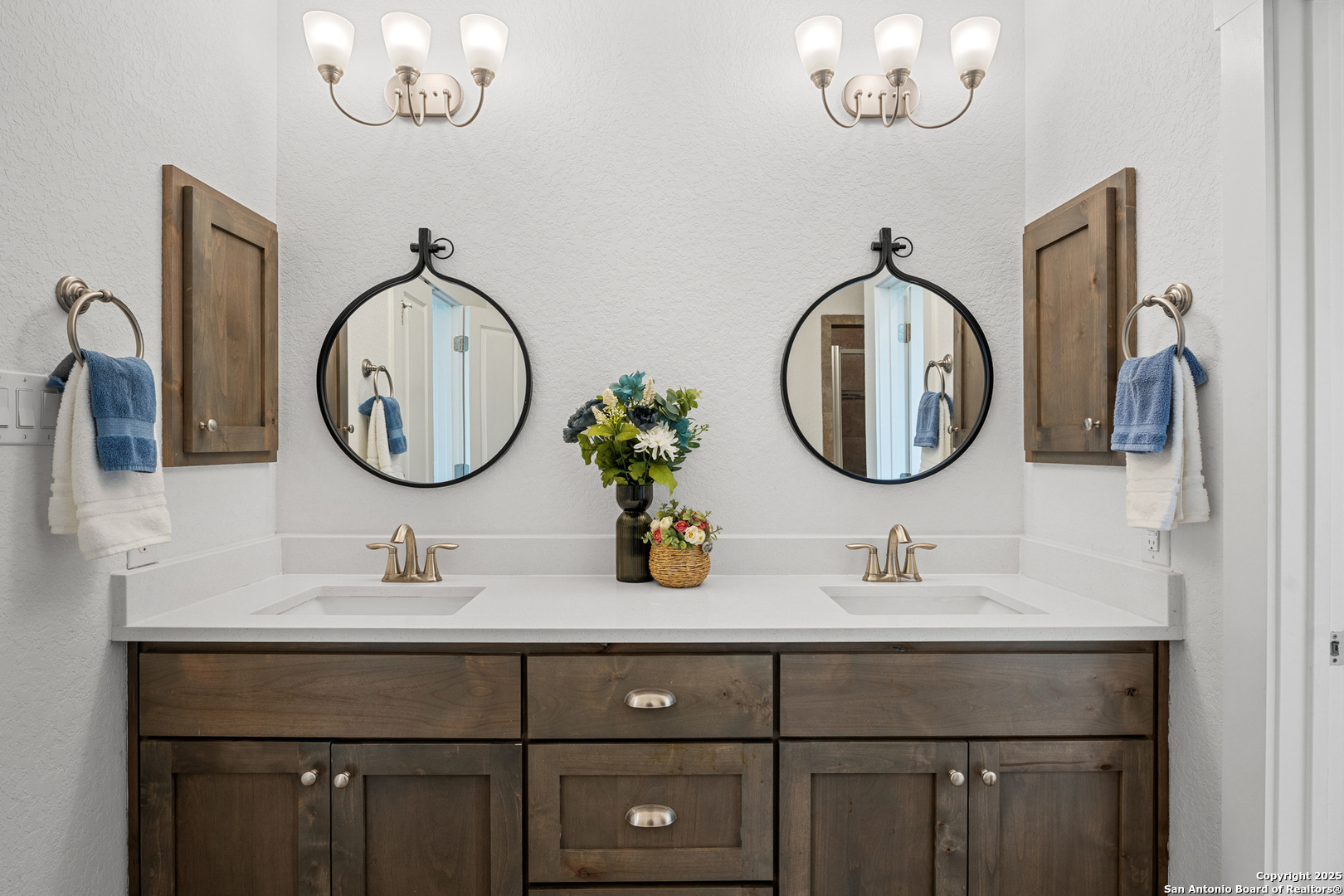 a bathroom with a double vanity sink and a mirror