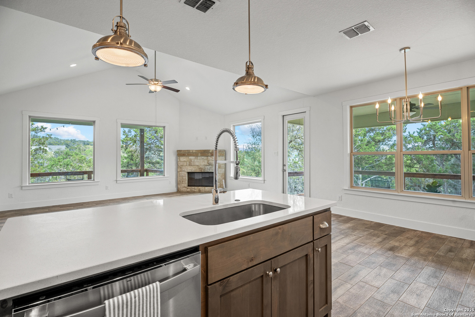 1039 Primrose Path Spring Branch, TX 78070 - Photo 13 of 30 a kitchen with a sink and large window