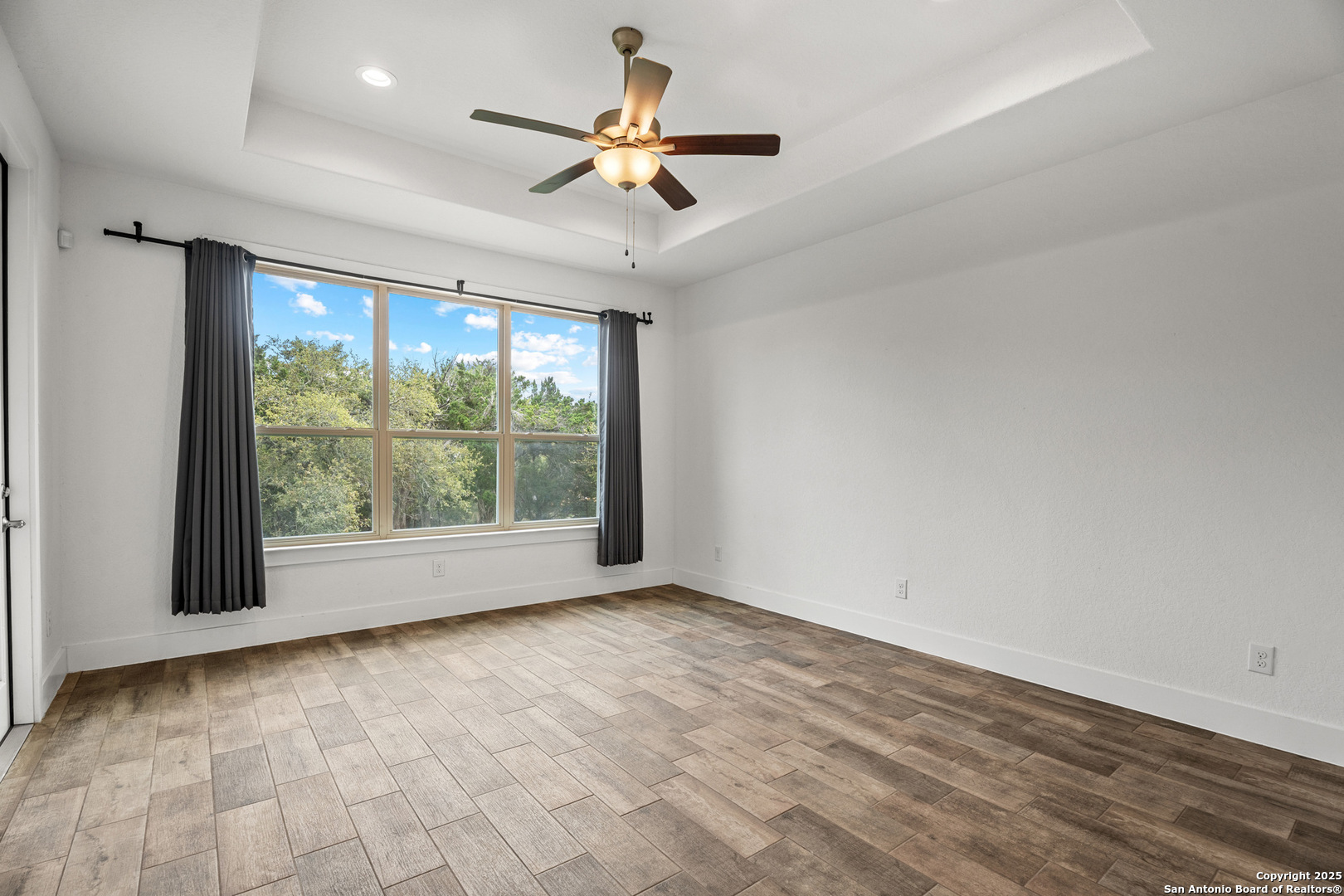 1039 Primrose Path Spring Branch, TX 78070 - Photo 14 of 30 a view of room with window and ceiling fan