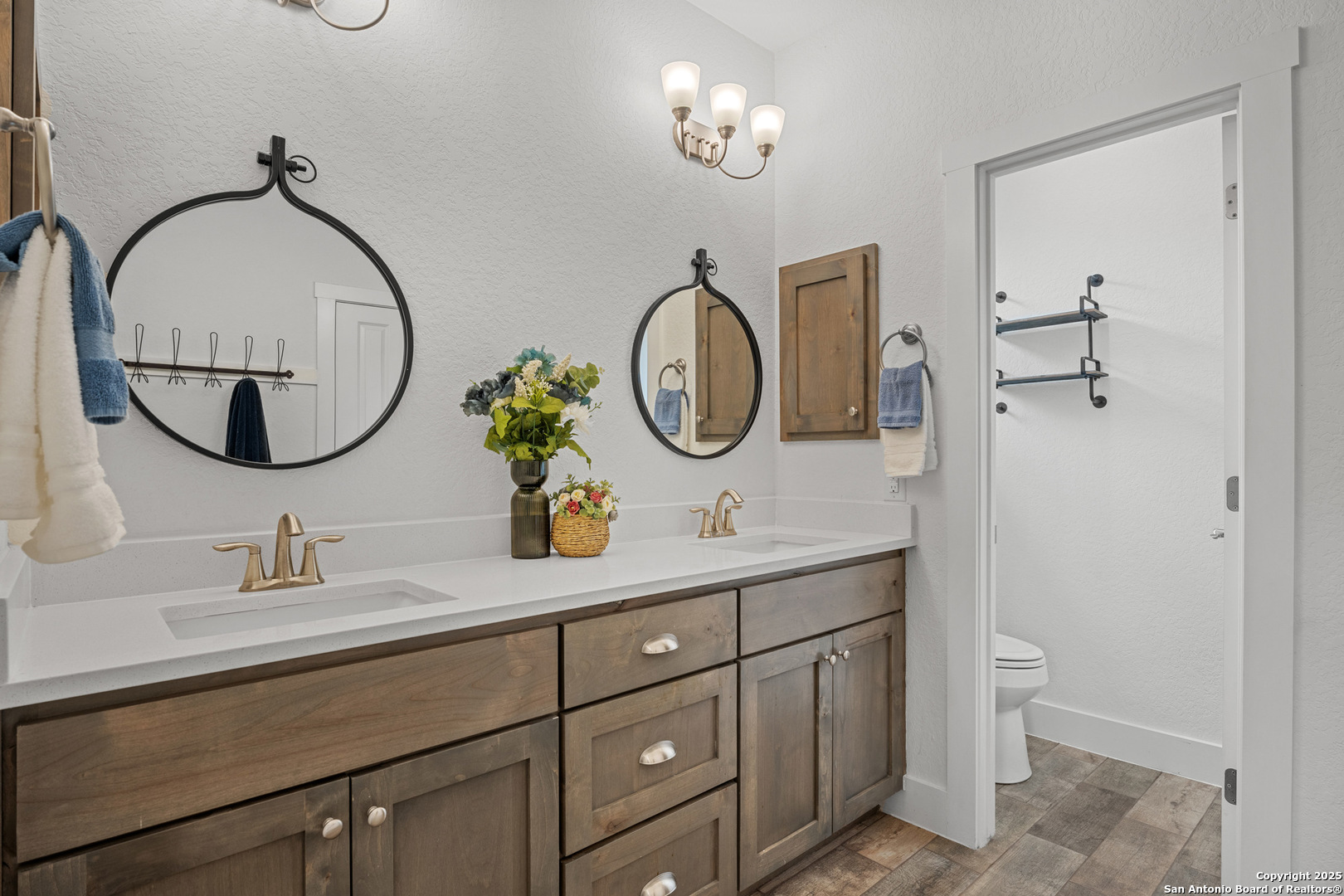 1039 Primrose Path Spring Branch, TX 78070 - Photo 17 of 30 a bathroom with a granite countertop double vanity sink and a mirror