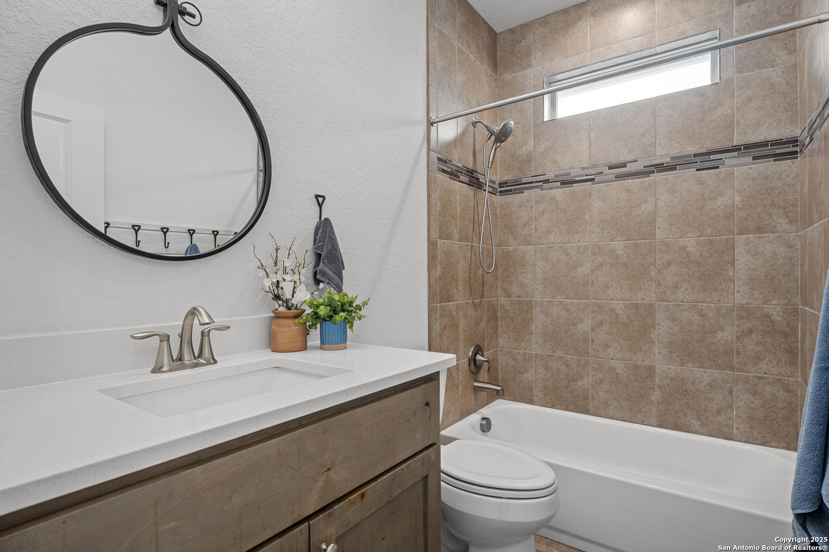 1039 Primrose Path Spring Branch, TX 78070 - Photo 21 of 30 a bathroom with a sink a toilet and a mirror