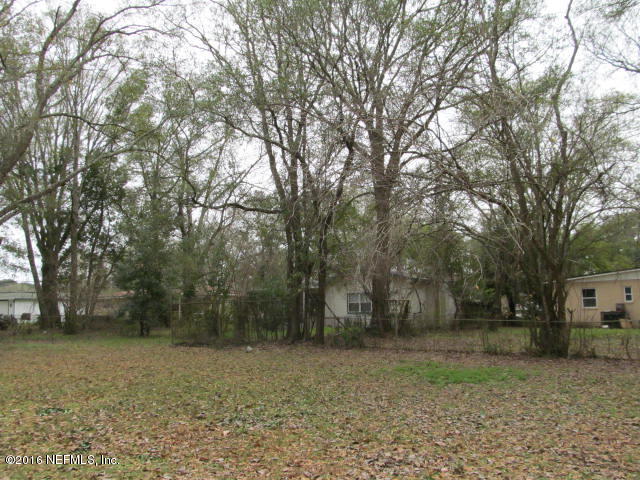 6718 Corday Road Jacksonville, FL 32208 - Photo 3 of 14 a view of a yard with trees