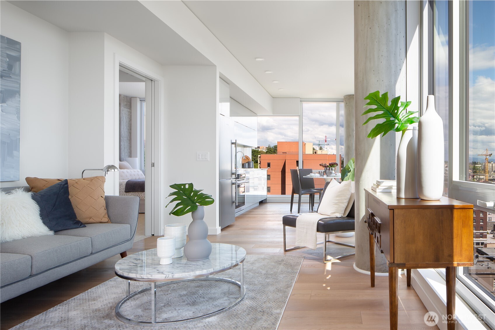 450 South Main Street, Unit 407 Seattle, WA 98104 - Photo 2 of 25 a living room with furniture and a potted plant