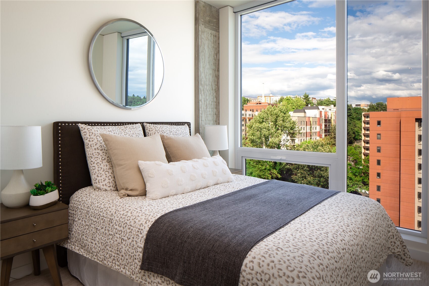 450 South Main Street, Unit 407 Seattle, WA 98104 - Photo 10 of 25 a bed sitting in a bedroom next to a window