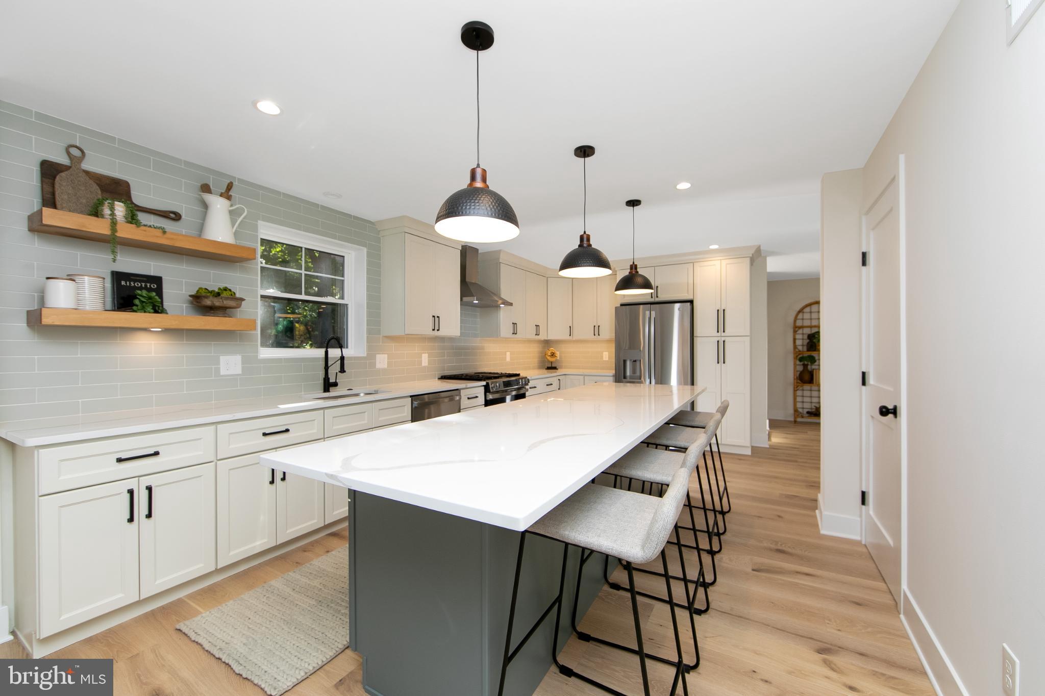 22 Scenic Road Springfield, PA 19064 - Photo 1 of 56 a kitchen with stainless steel appliances a sink a stove a refrigerator and cabinets