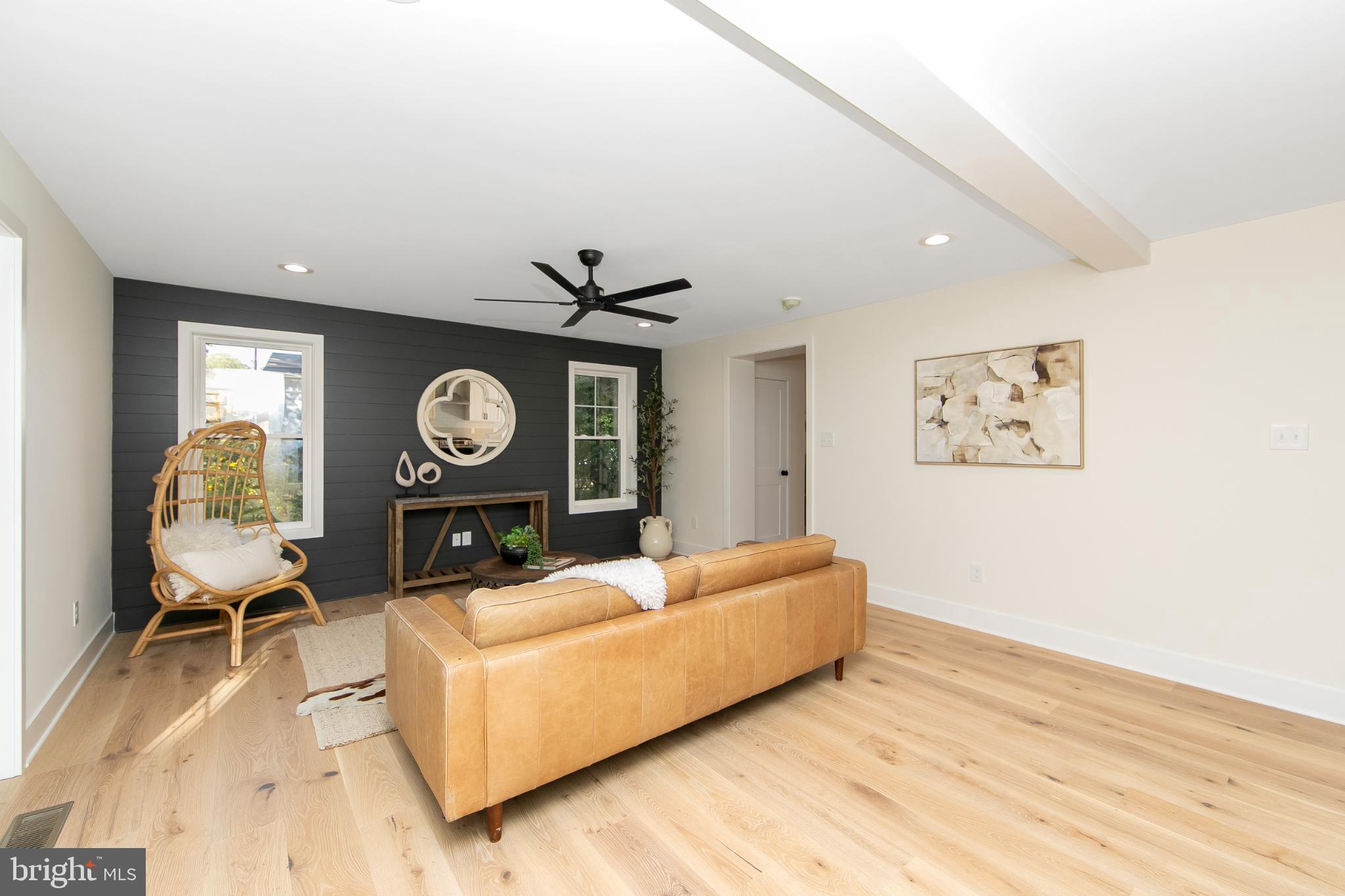 22 Scenic Road Springfield, PA 19064 - Photo 20 of 56 a living room with furniture and a clock