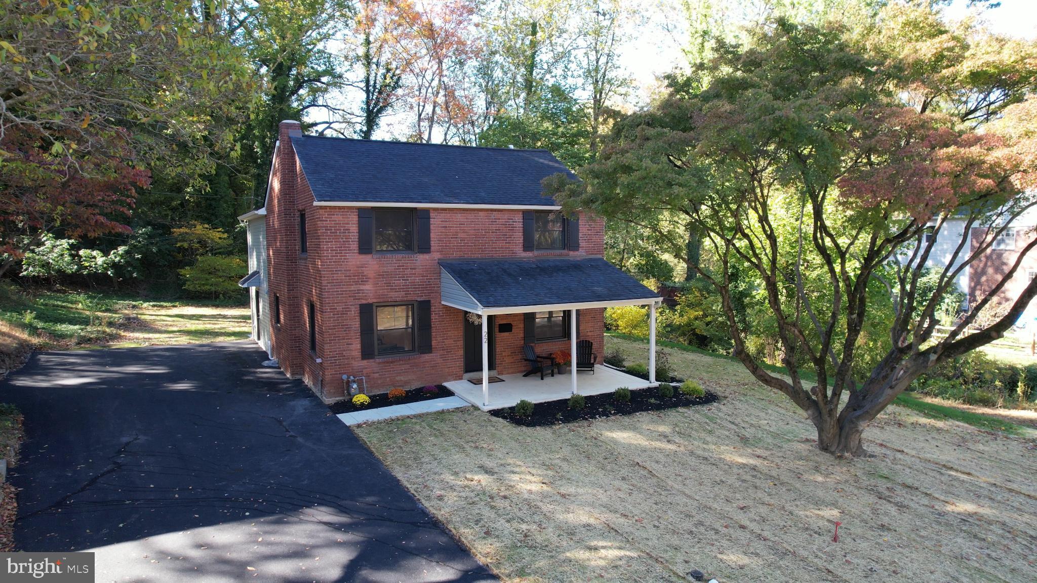 22 Scenic Road Springfield, PA 19064 - Photo 2 of 56 a house view with a sitting space and garden