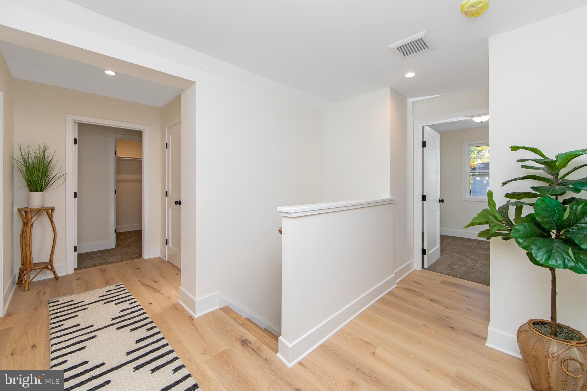 22 Scenic Road Springfield, PA 19064 - Photo 24 of 56 a view of a hallway with wooden floor and a potted plant