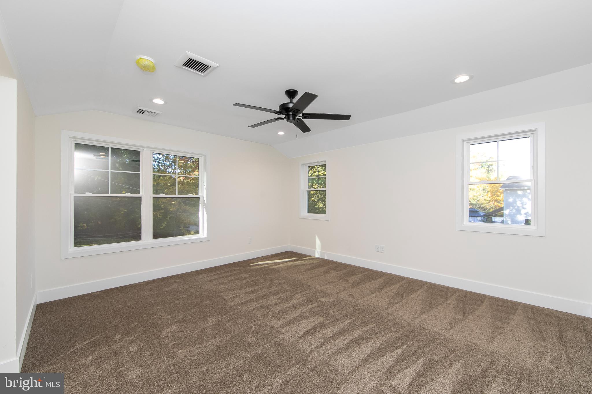 22 Scenic Road Springfield, PA 19064 - Photo 25 of 56 an empty room with a window and a ceiling fan