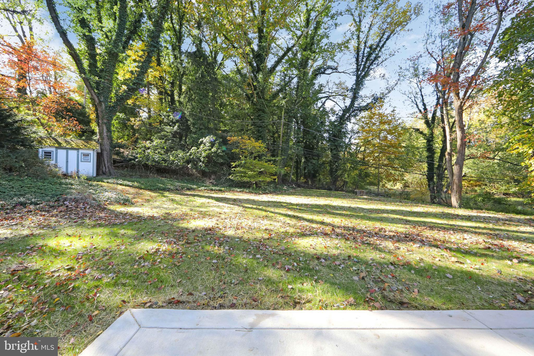 22 Scenic Road Springfield, PA 19064 - Photo 47 of 56 a view of a yard with large trees