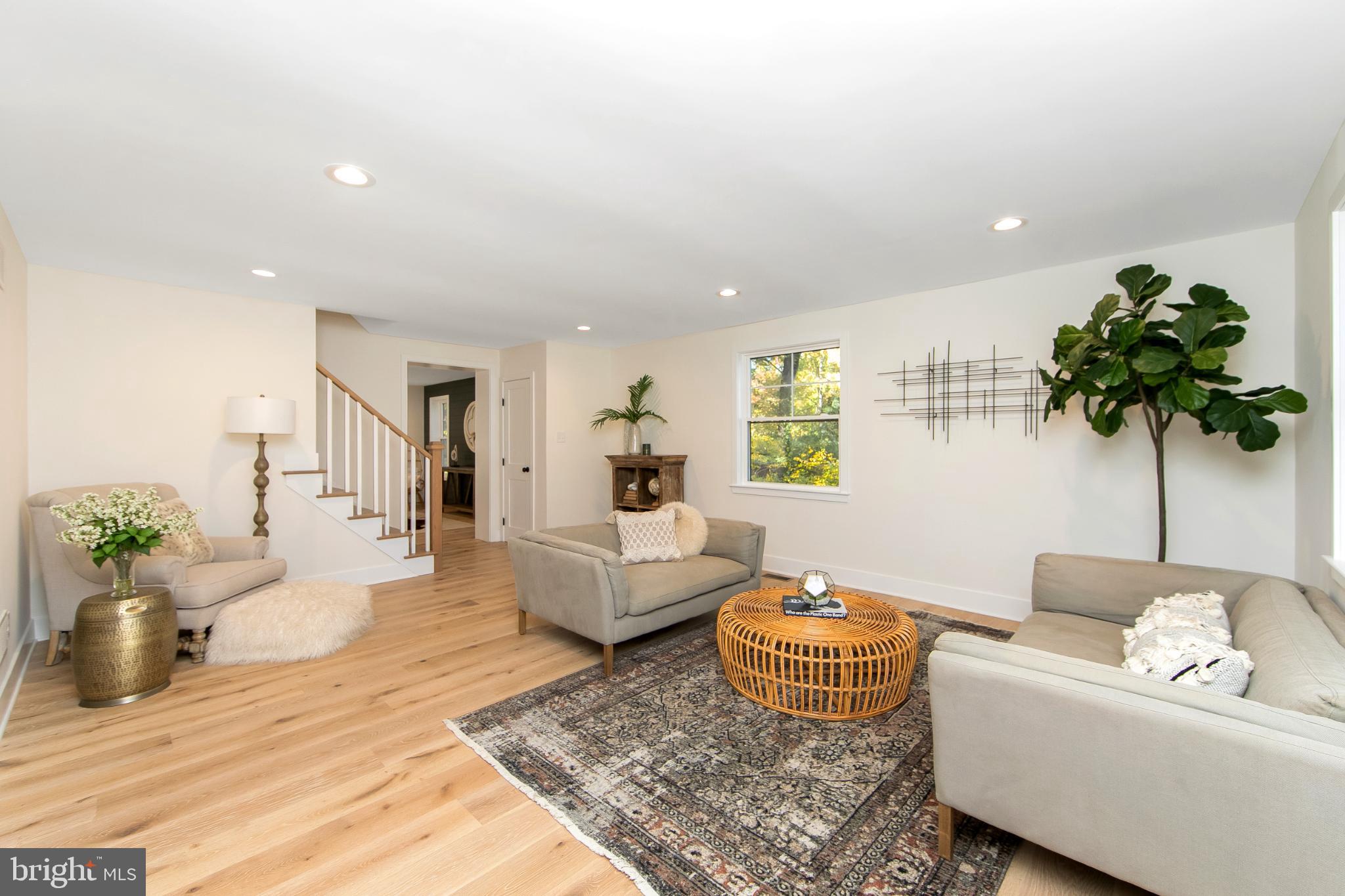22 Scenic Road Springfield, PA 19064 - Photo 6 of 56 a living room with furniture and a potted plant