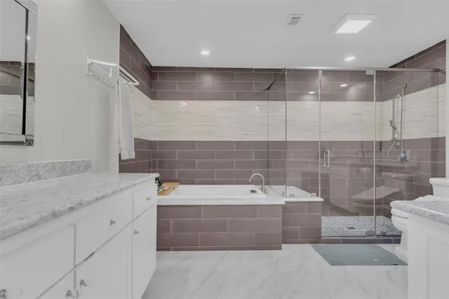 a bathroom with a bathtub and sink