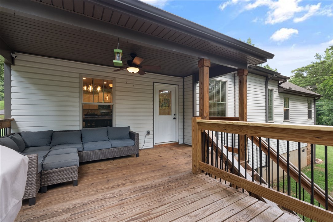 201 Hearthstone Drive Anderson, SC 29621 - Photo 15 of 49 A spacious covered deck extends the living area, perfect for tranquil outdoor relaxation.