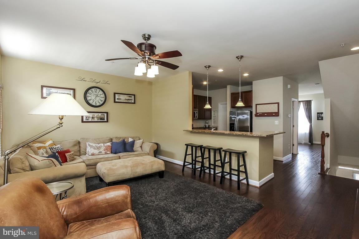 11603 Leesborough Circle Silver Spring, MD 20902 - Photo 3 of 30 a living room with furniture and wooden floor