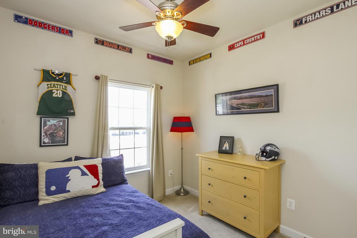 11603 Leesborough Circle Silver Spring, MD 20902 - Photo 21 of 30 a bedroom with a bed and wooden floor