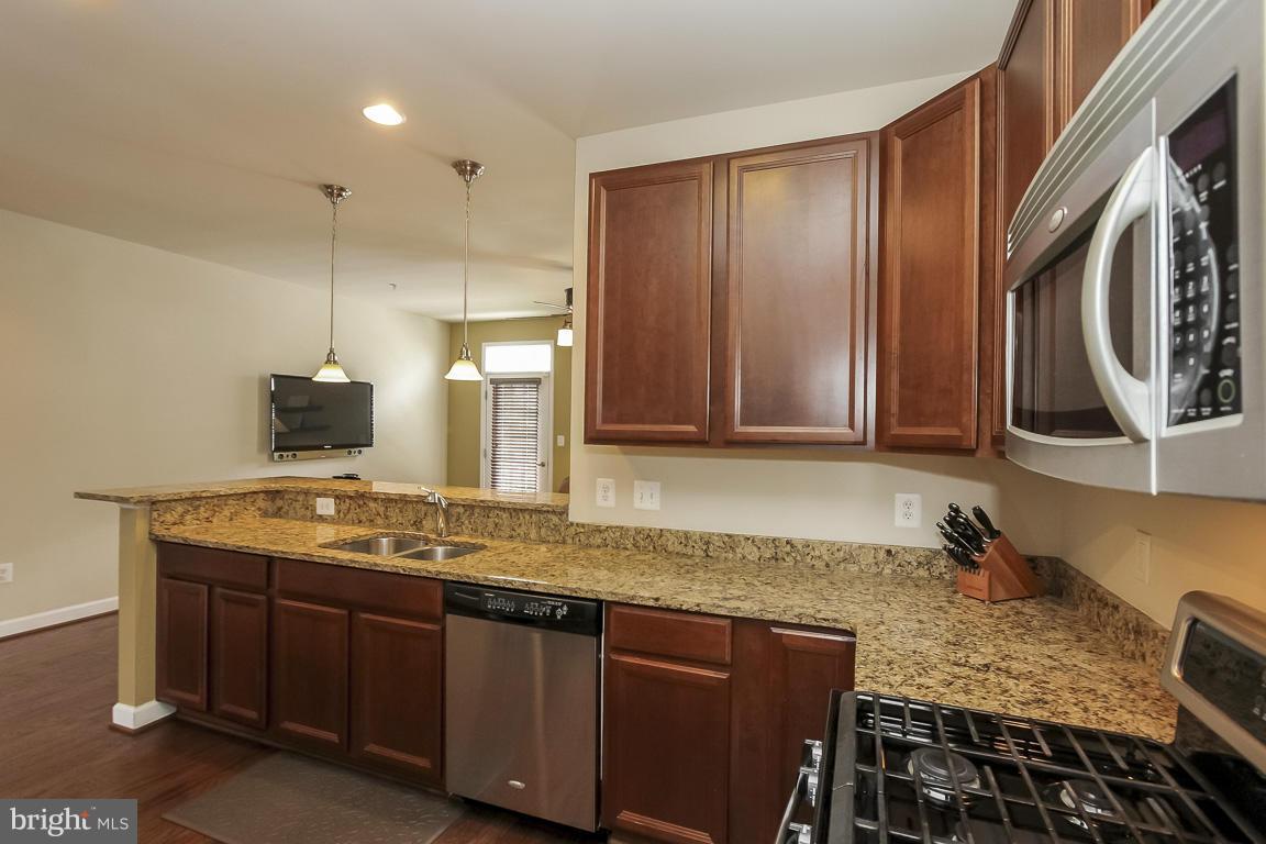 11603 Leesborough Circle Silver Spring, MD 20902 - Photo 5 of 30 a bathroom with a granite countertop sink and a mirror