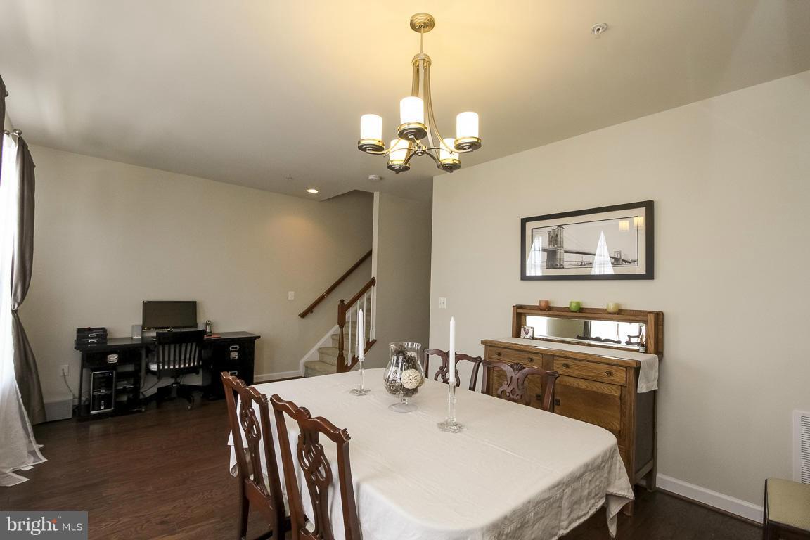 11603 Leesborough Circle Silver Spring, MD 20902 - Photo 9 of 30 a view of a dining room with furniture and a chandelier