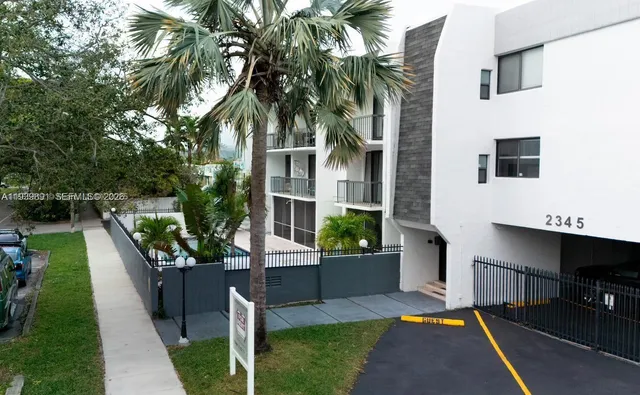 a kitchen with cabinets stainless steel appliances and a counter space