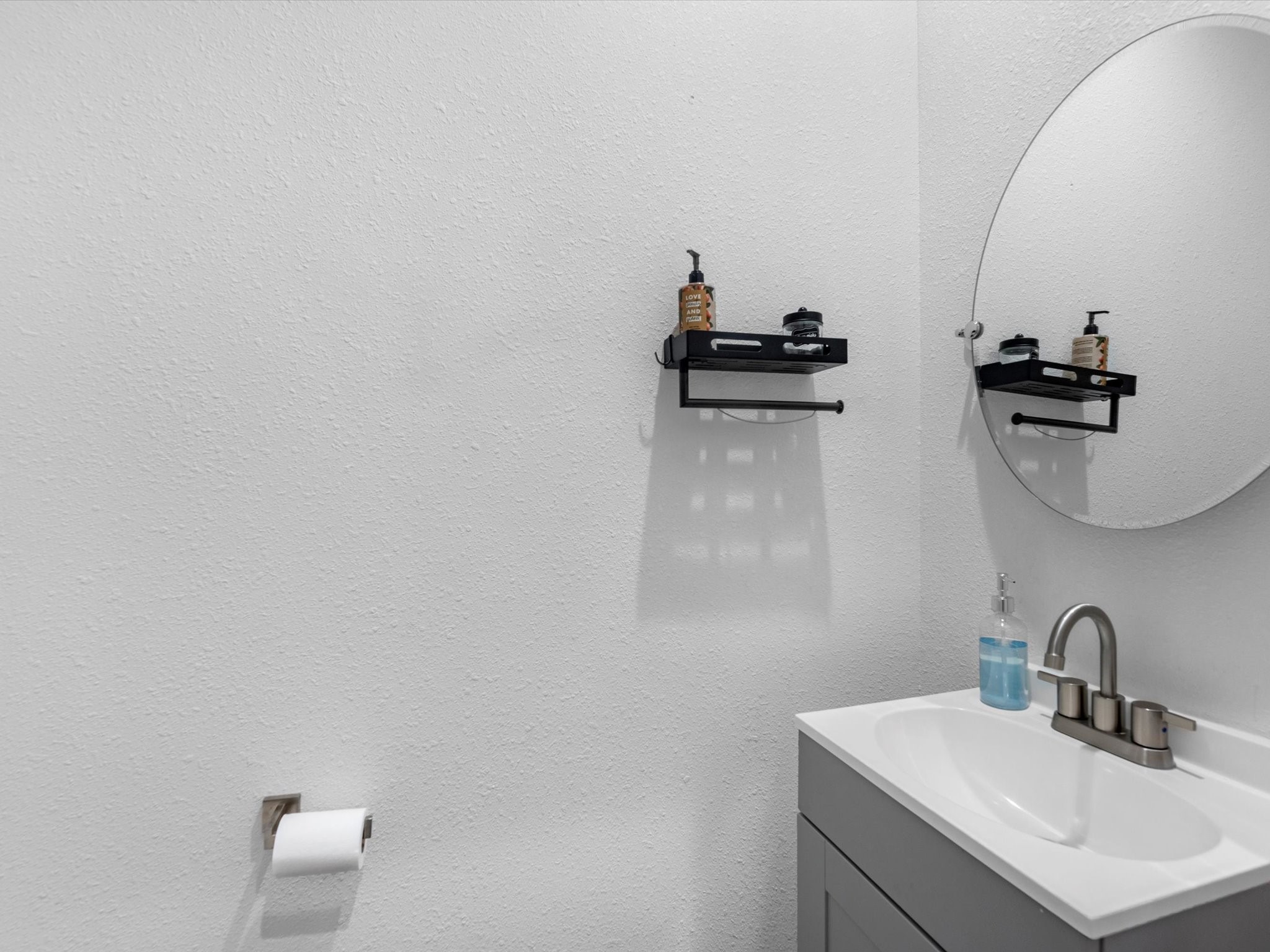2222 Wavell Street Houston, TX 77088 - Photo 12 of 24 a bathroom with a sink and a mirror