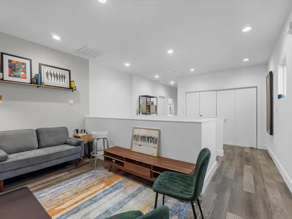 a living room with furniture and a rug
