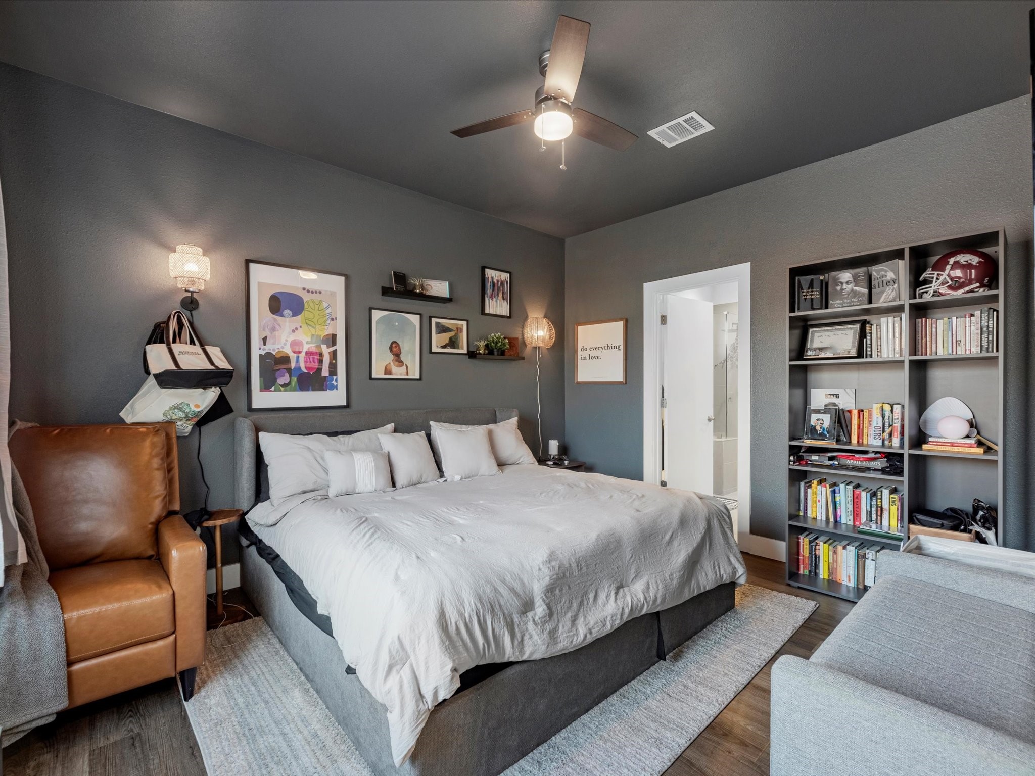 2222 Wavell Street Houston, TX 77088 - Photo 15 of 24 a bedroom with a bed furniture and a book shelf