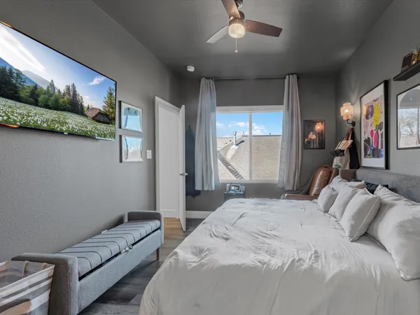 a bedroom with a bed and a couch