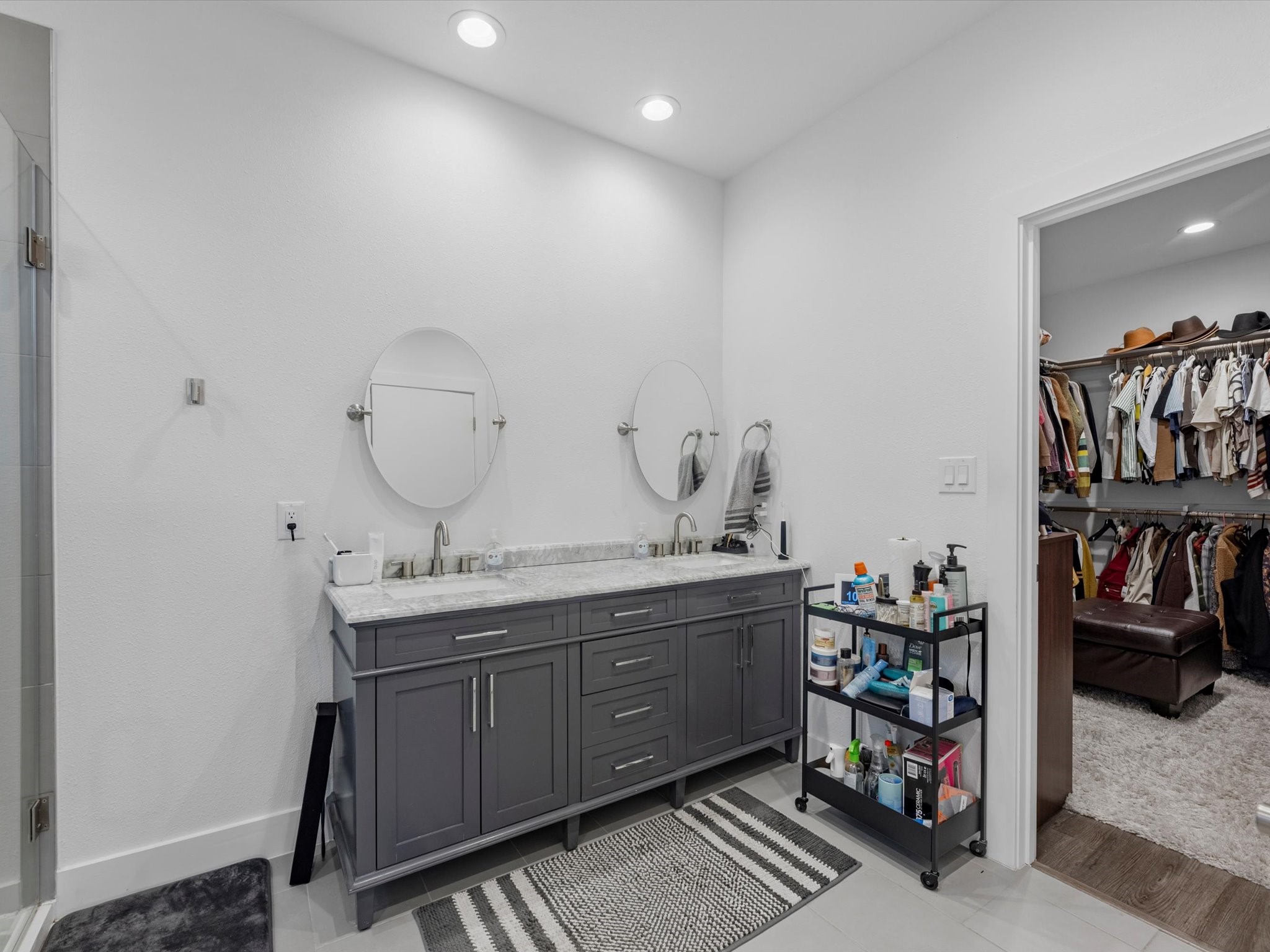2222 Wavell Street Houston, TX 77088 - Photo 17 of 24 a spacious bathroom with a double vanity sink and a mirror