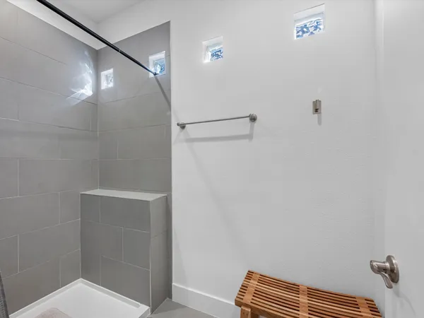 a bathroom with a shower and a toilet