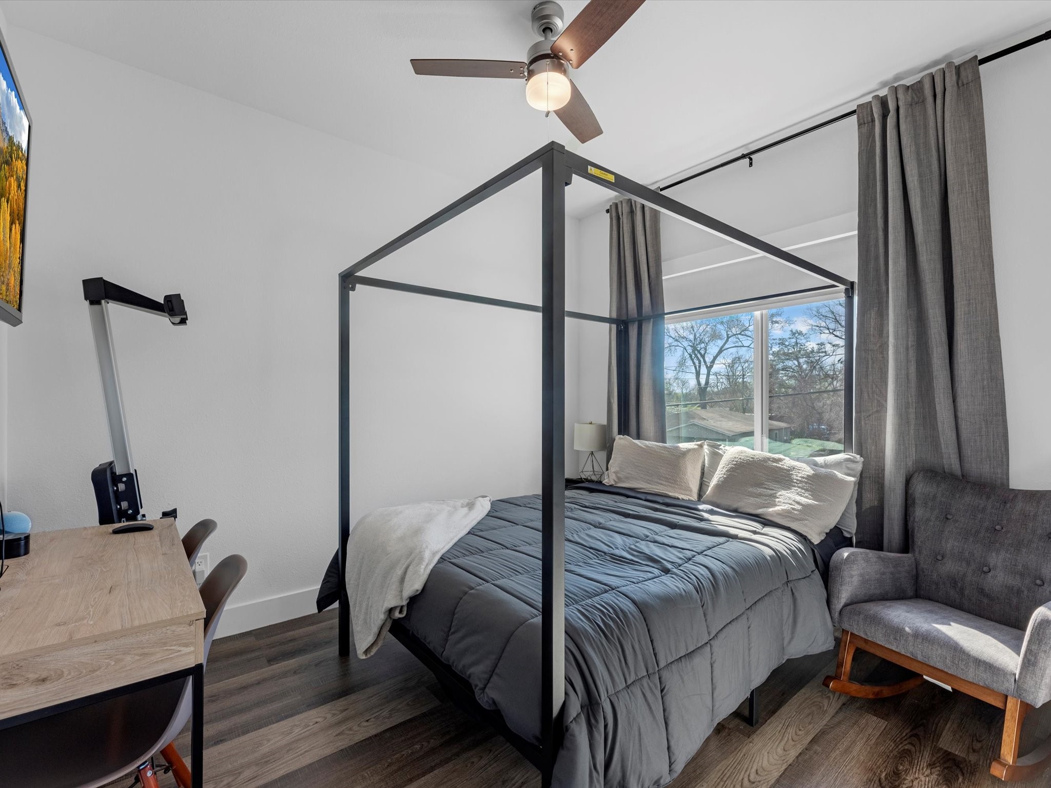 2222 Wavell Street Houston, TX 77088 - Photo 22 of 24 a bedroom with a bed window and a table