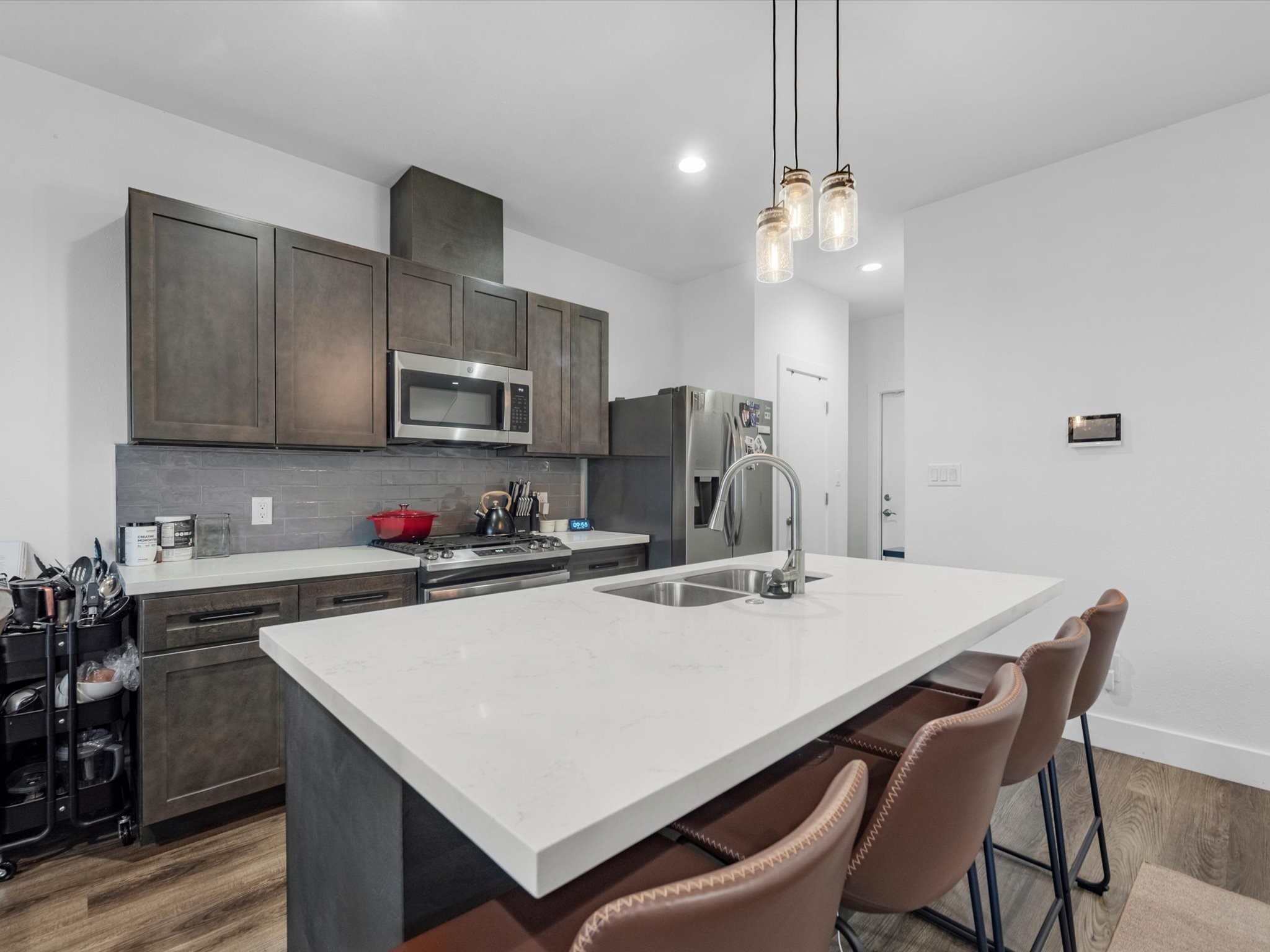 2222 Wavell Street Houston, TX 77088 - Photo 7 of 24 a kitchen that has a table chairs stainless steel appliances and cabinets