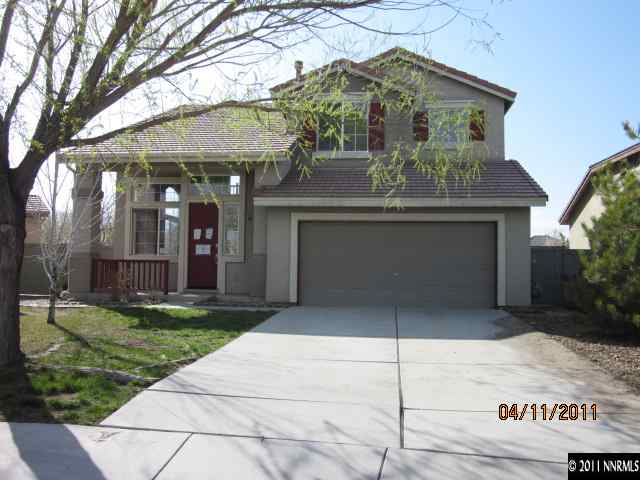 9931 Northrup Drive Reno, NV 89521 - Photo 1 of 8 a front view of a house with garden