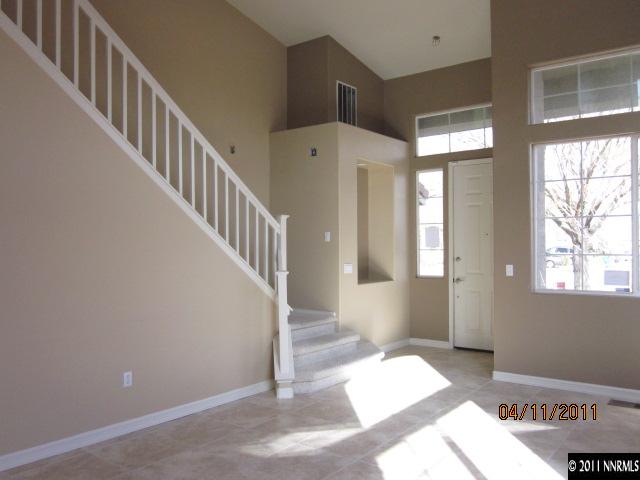 9931 Northrup Drive Reno, NV 89521 - Photo 3 of 8 a view of staircase with white walls and windows