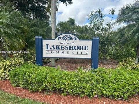 1140 Independence Trail, Unit 1140H Homestead, FL 33034 - Photo 2 of 7 a sign that is sitting on a brick wall